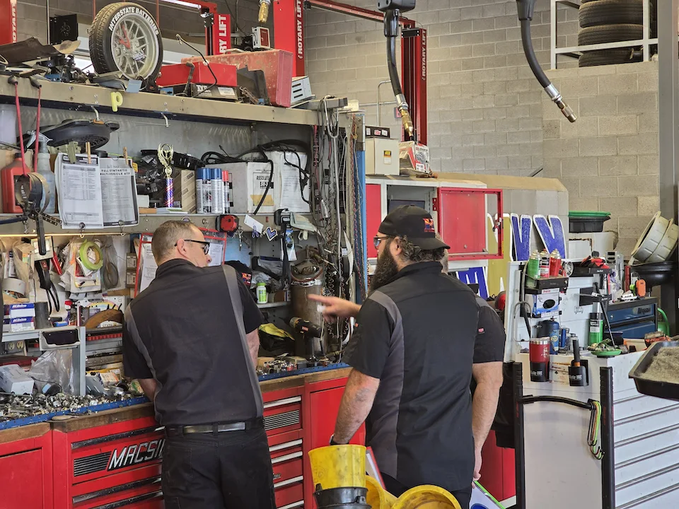 h&i automotive technicians at tool bench